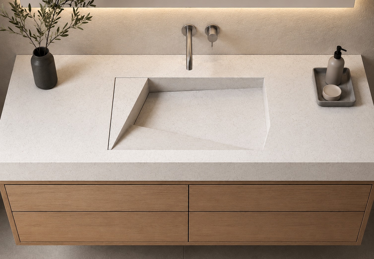 A basin cut into the same slab as its top
