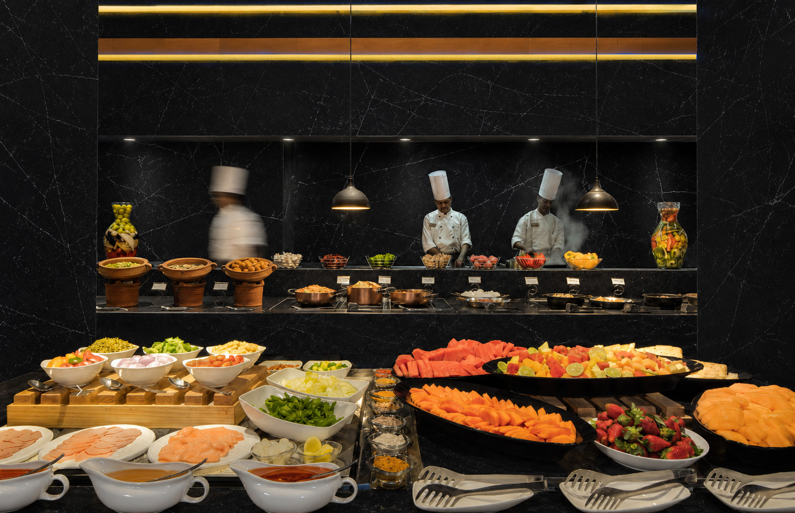A buffet in front of an open kitchen