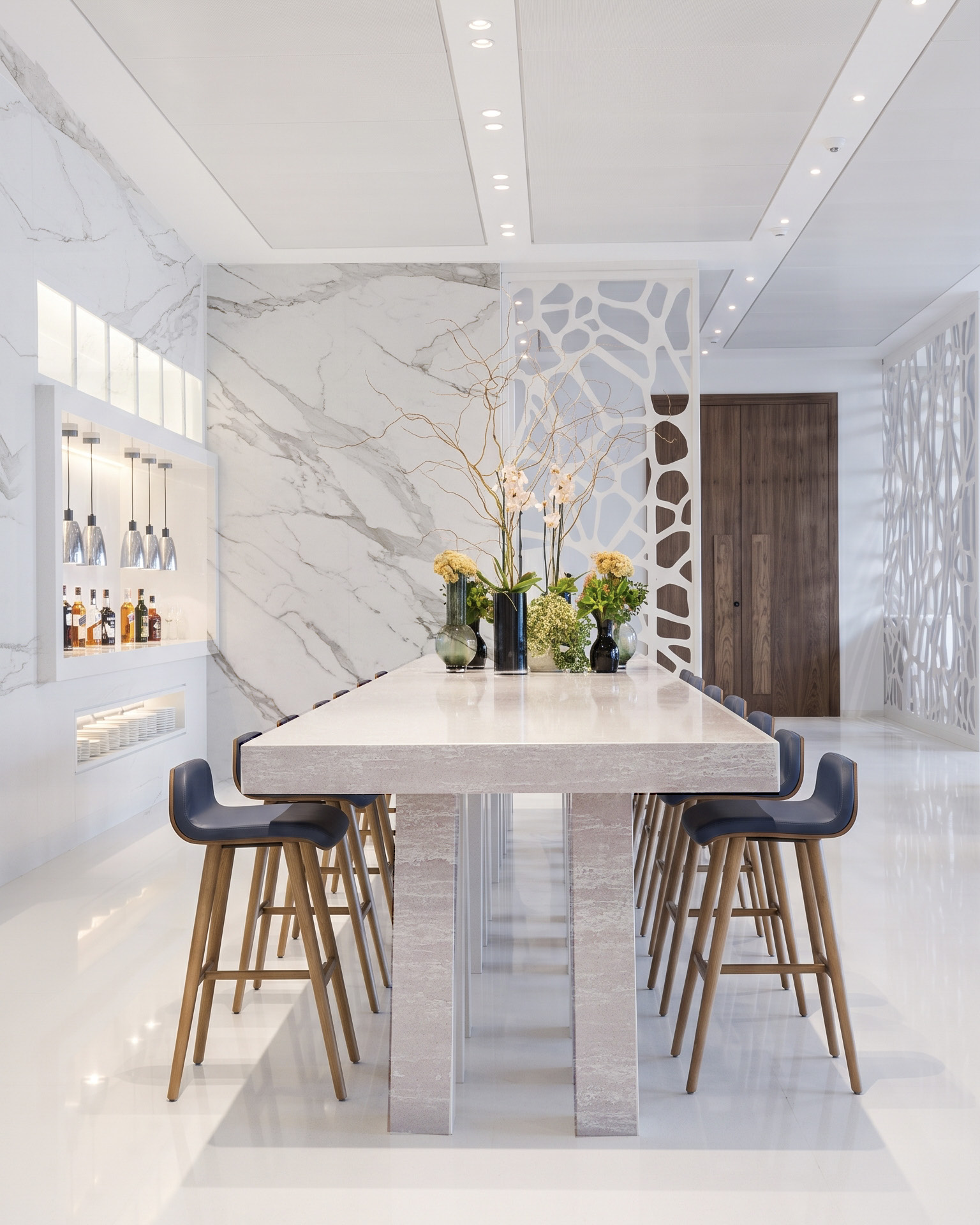 A long communal table in white quartz