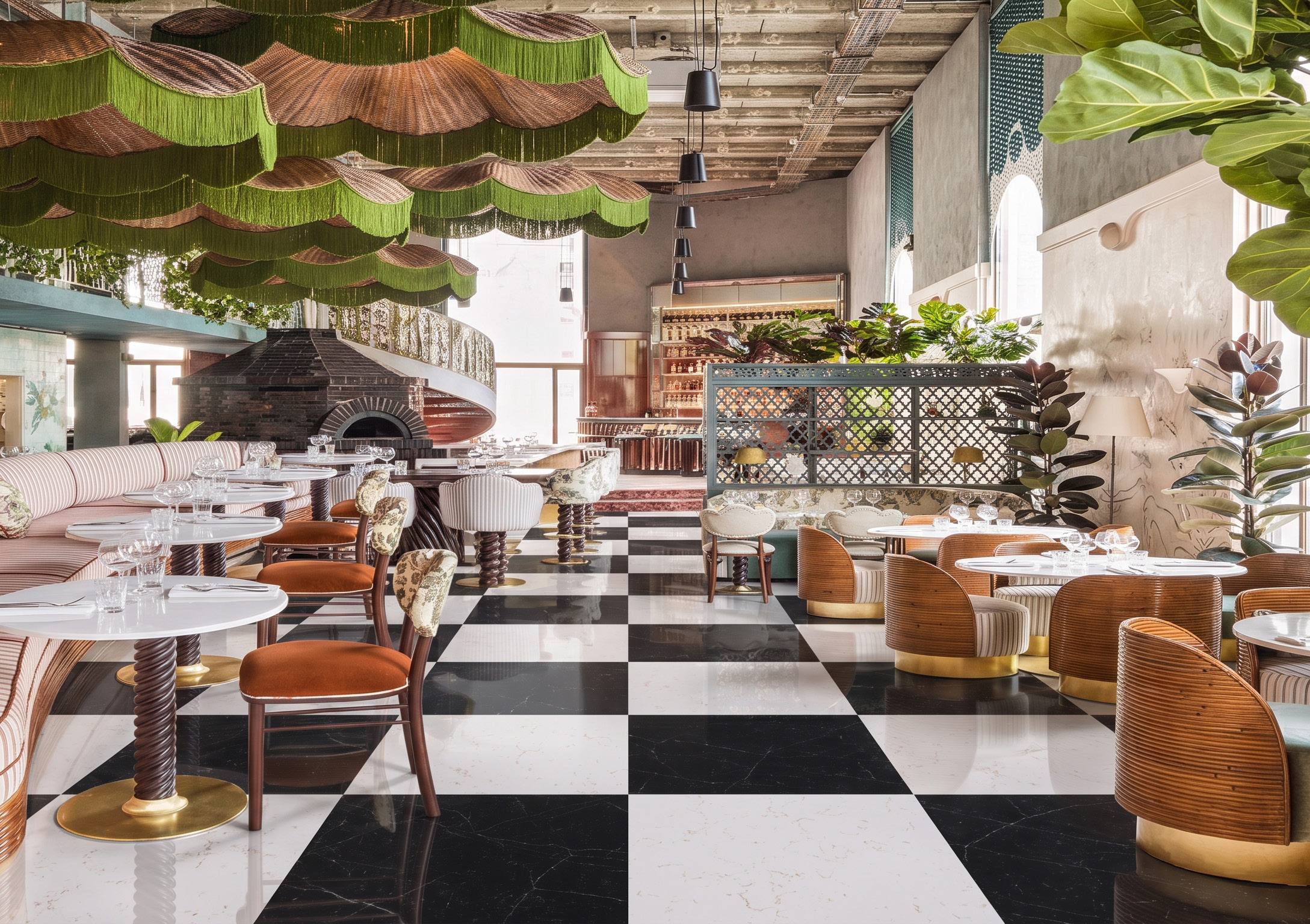 A restaurant dining room with a dark and light chequered floor