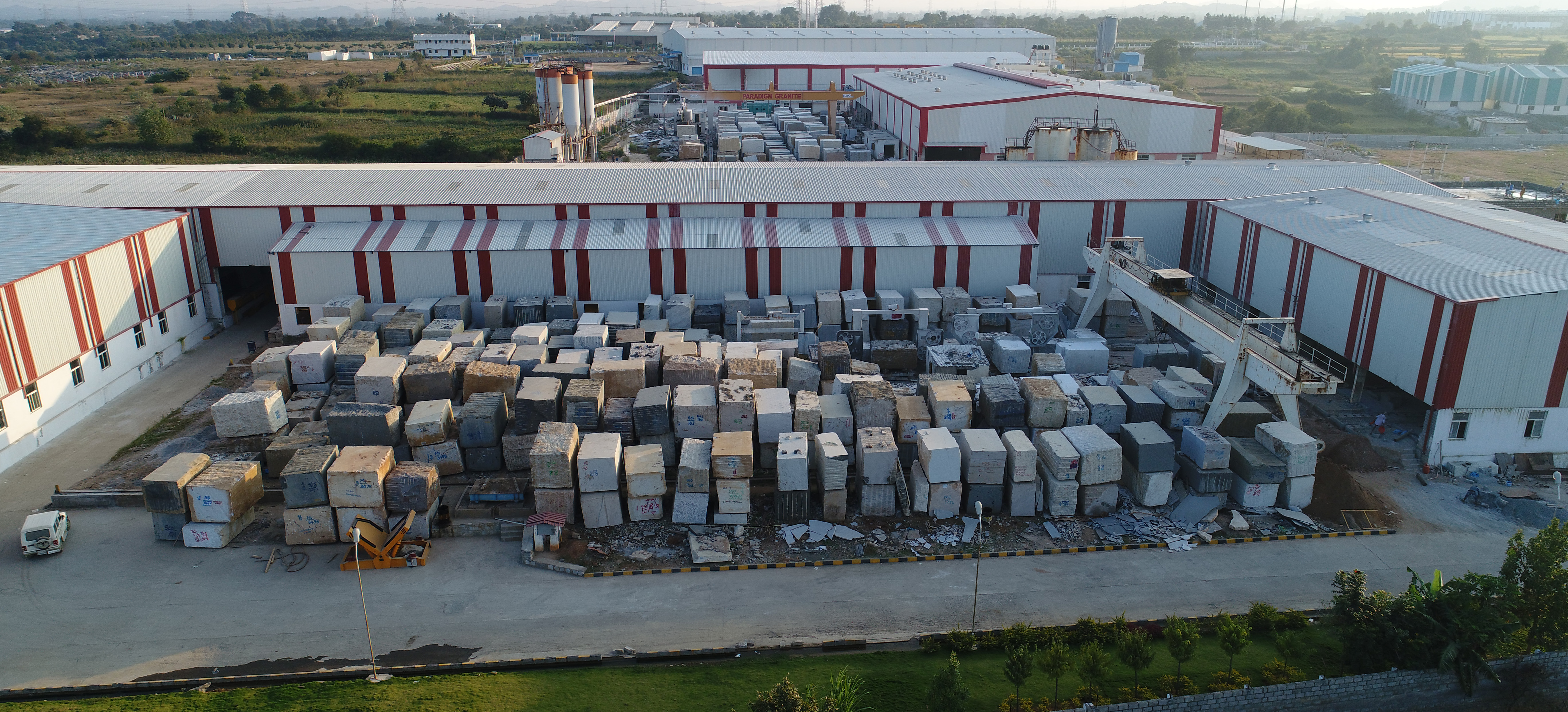 The block yard from above, granite blocks in rows beside the factory