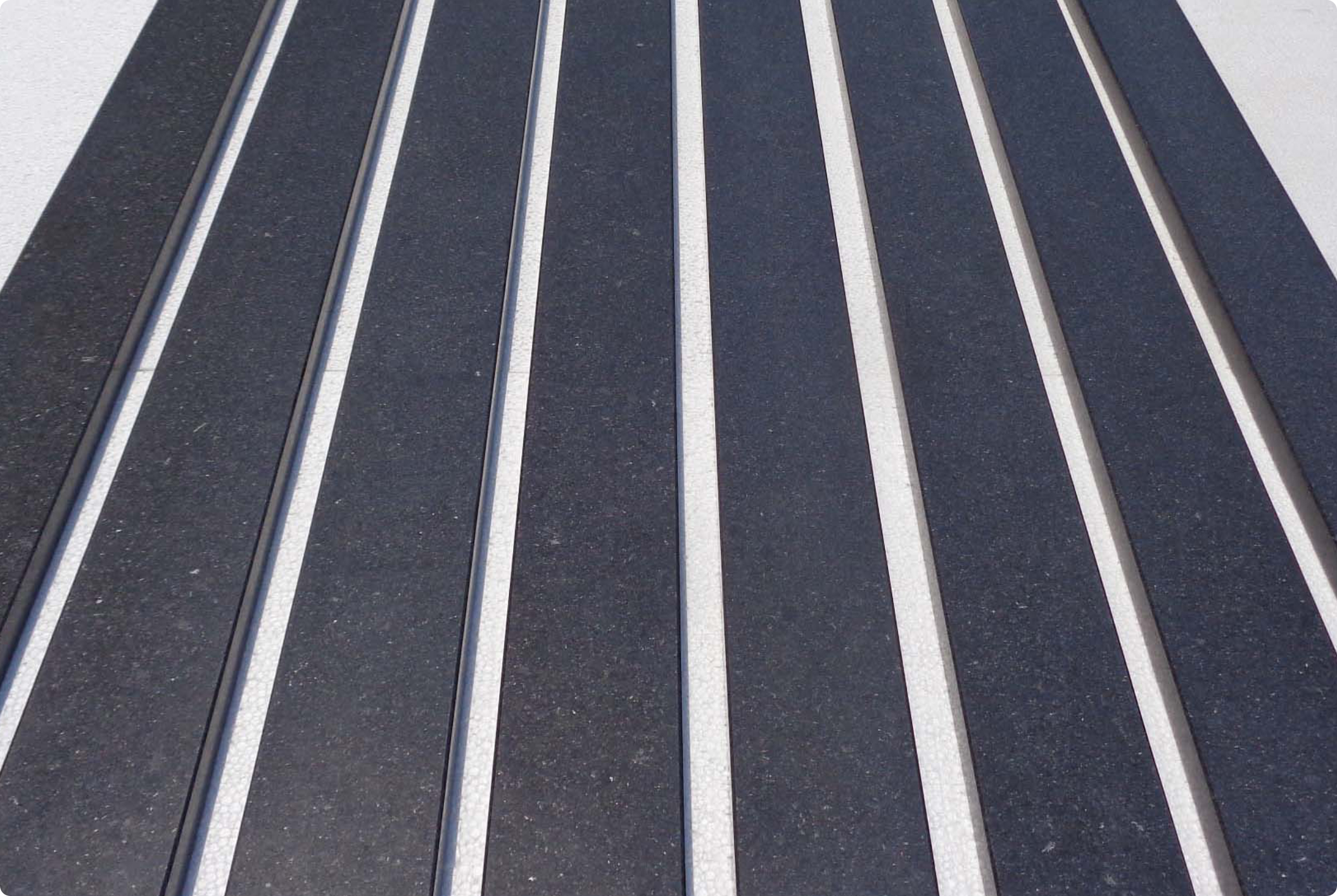 Black granite sills laid out in a row