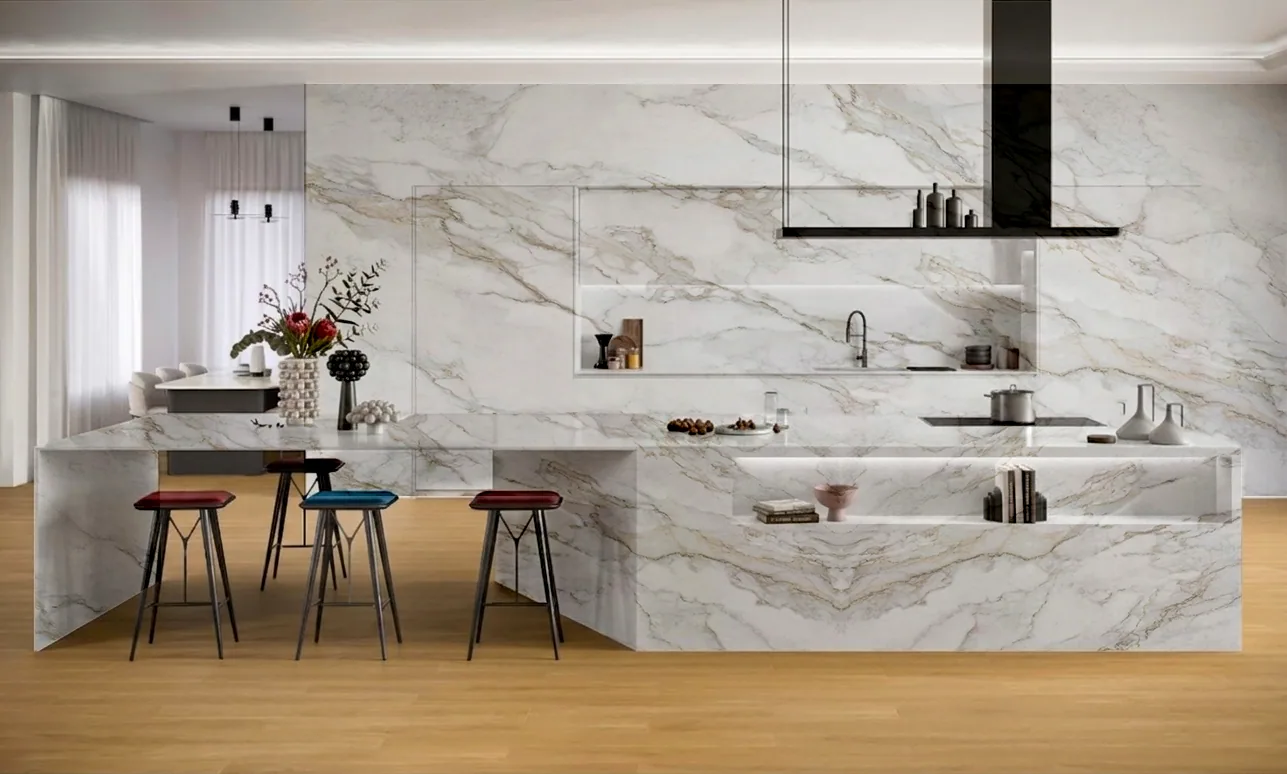 A kitchen with a stone island and a matching wall