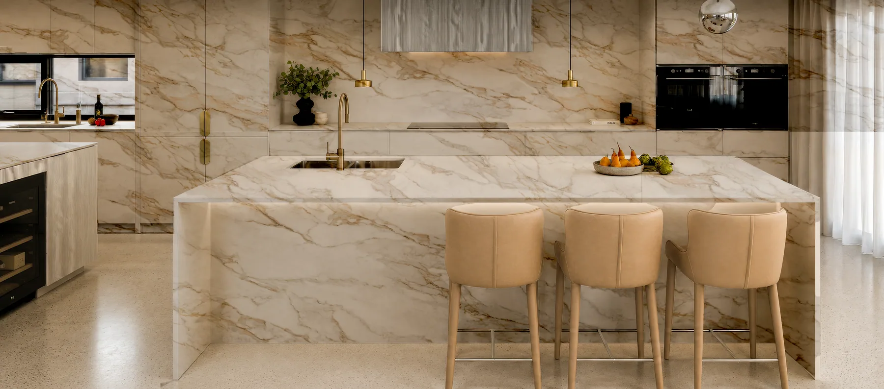 A full-height stone backsplash behind a hob