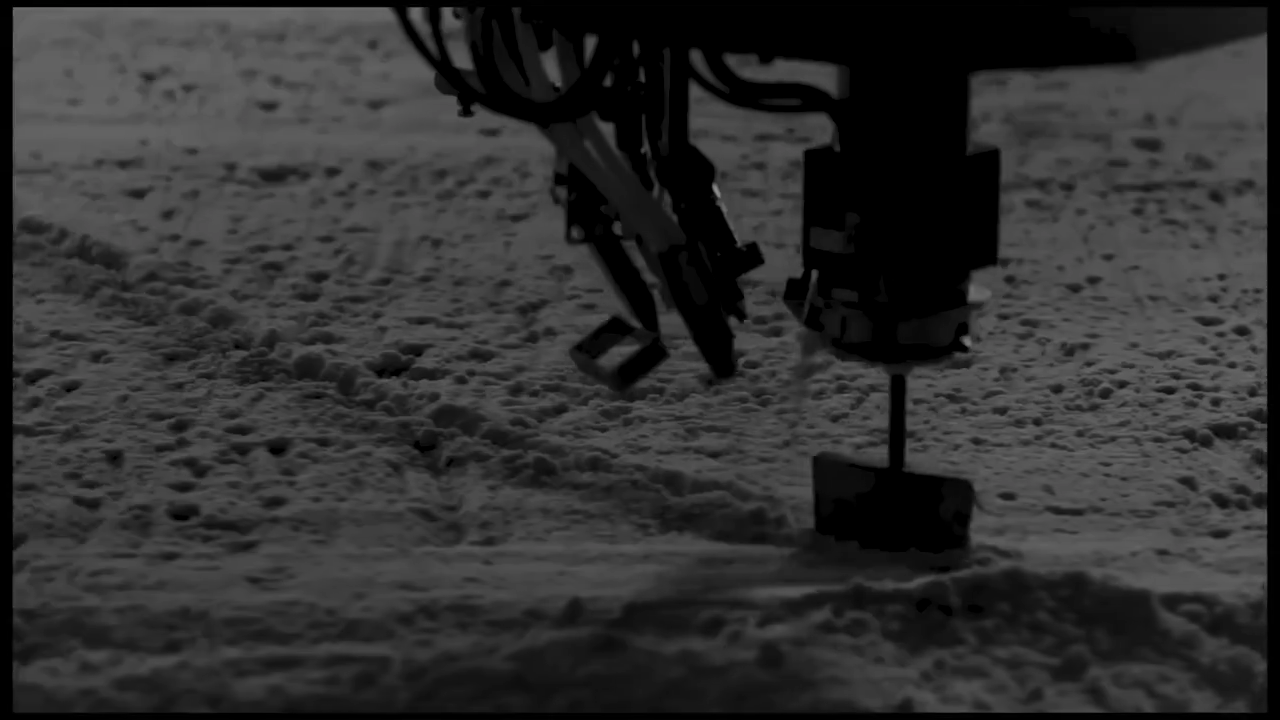 A Breton robot over the quartz mix at the Pacific Surfaces plant